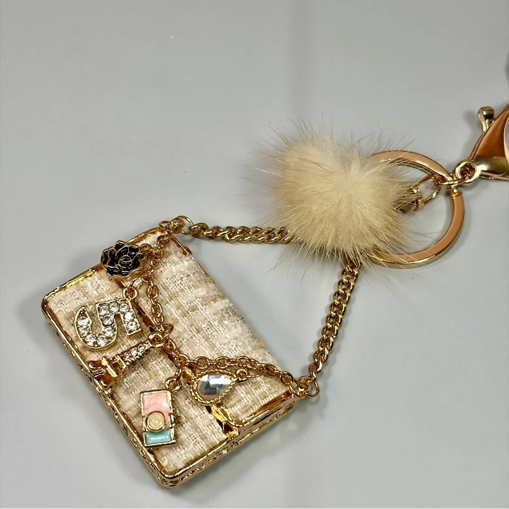 Chic Cream Tweed Mini Bag Keychain with Gold Chain and Pom